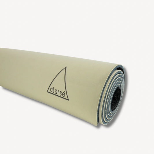 Tan yoga mat with a Alerse logo on it.