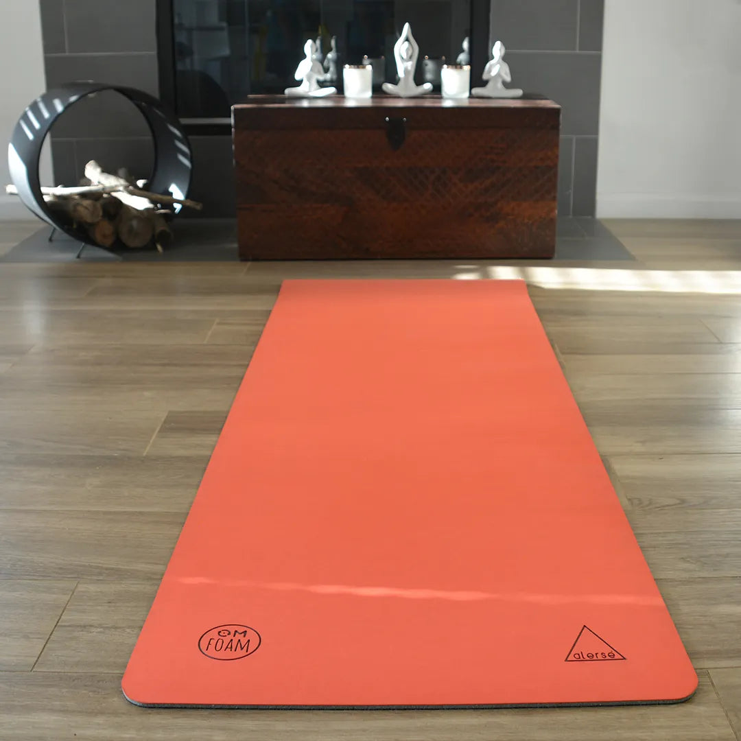Red yoga mat flat on the floor.