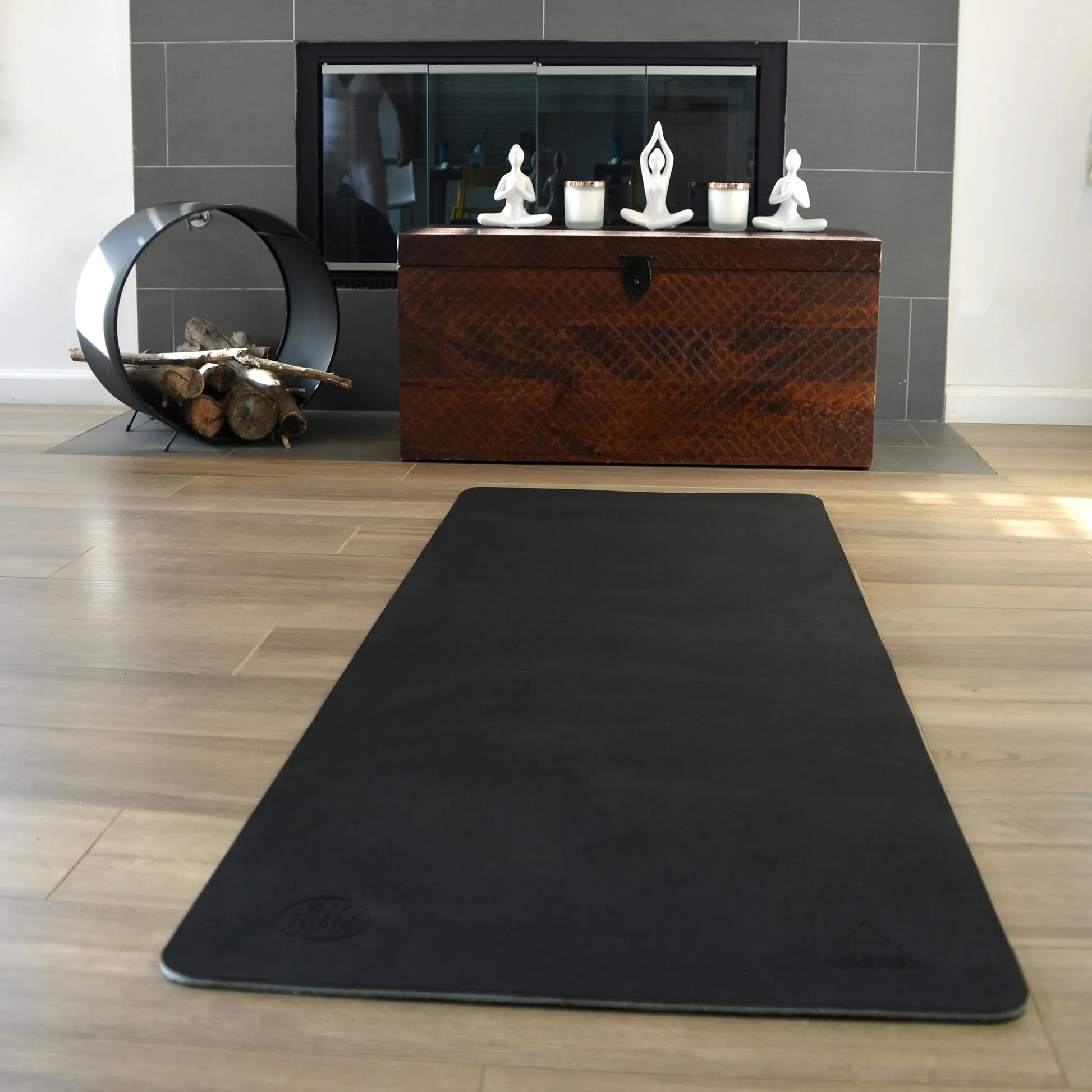 Black yoga mat lying flat.