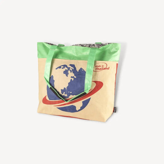 Tote bag with blue planet and red rings on it.