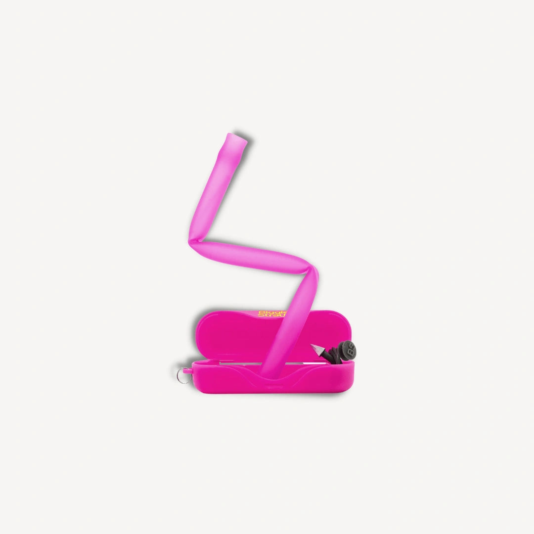 Pink flexible straw bending out of a pink case.
