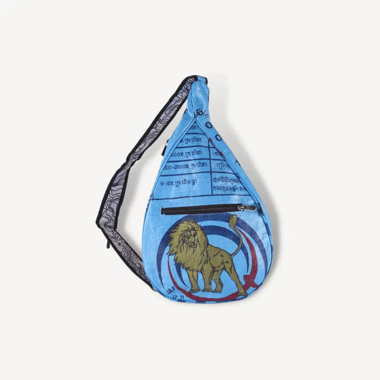 Blue sling bag with lion on it.