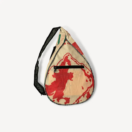 Sling bag with a red mountain on it.