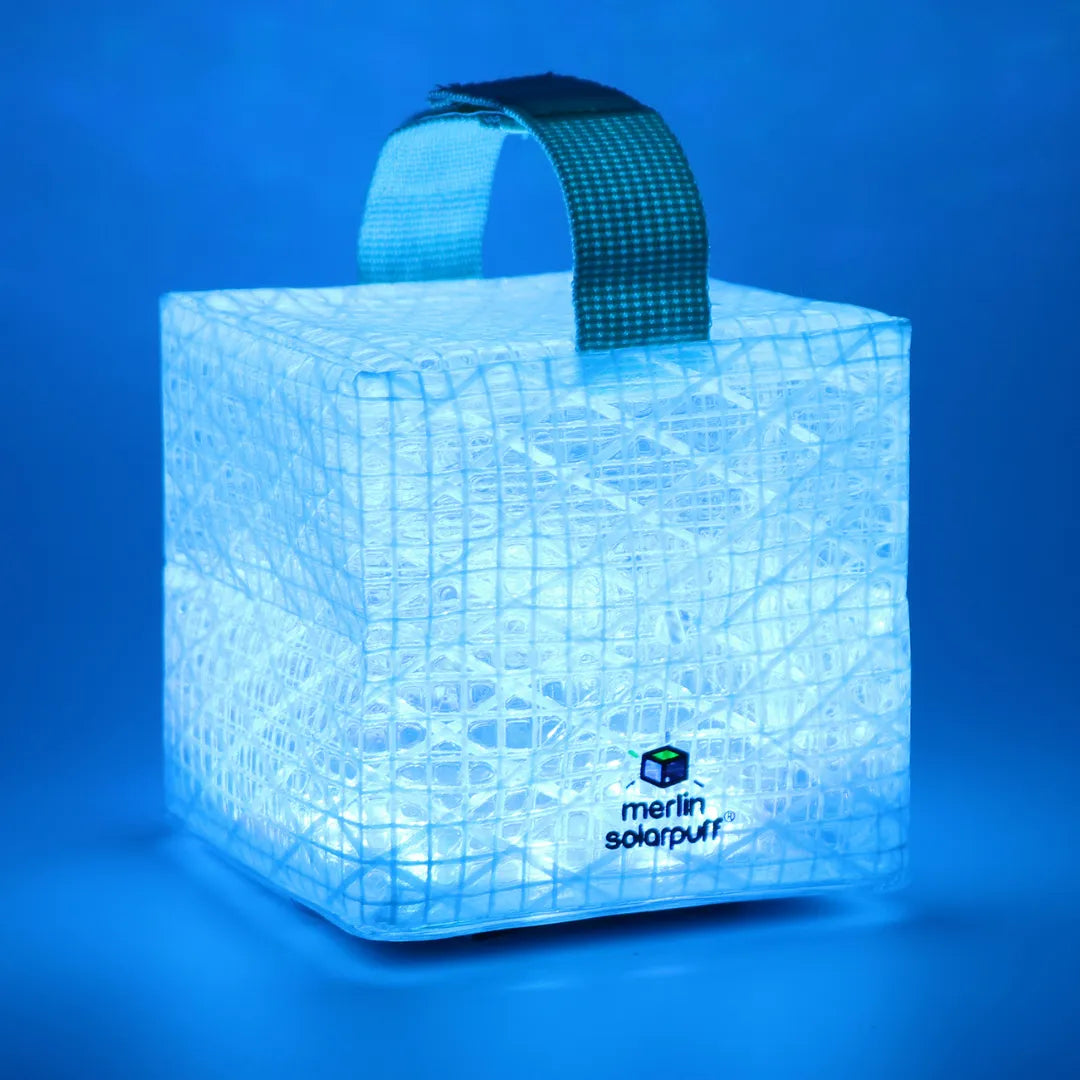 Blue cube lantern with a strap on top.