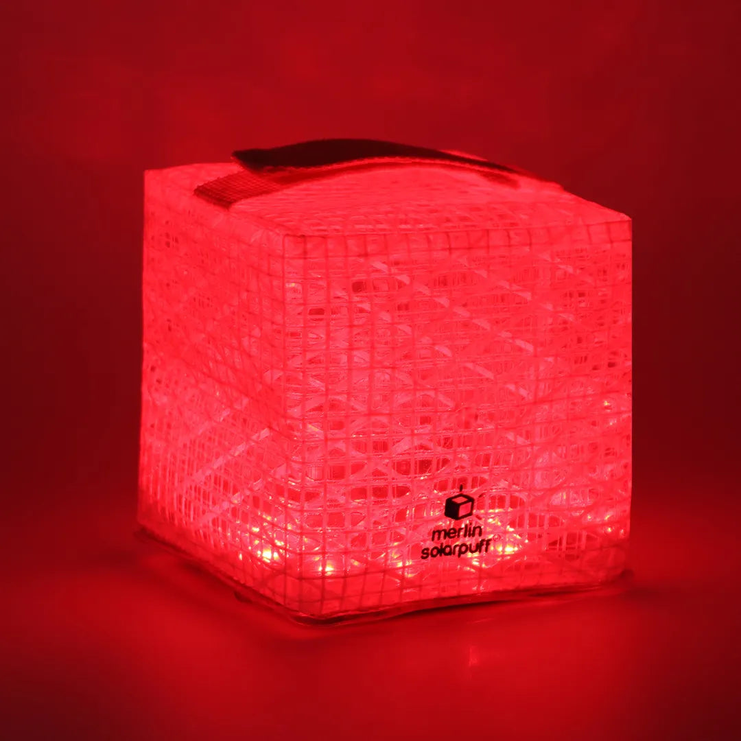 Red cube lantern with a strap on top.