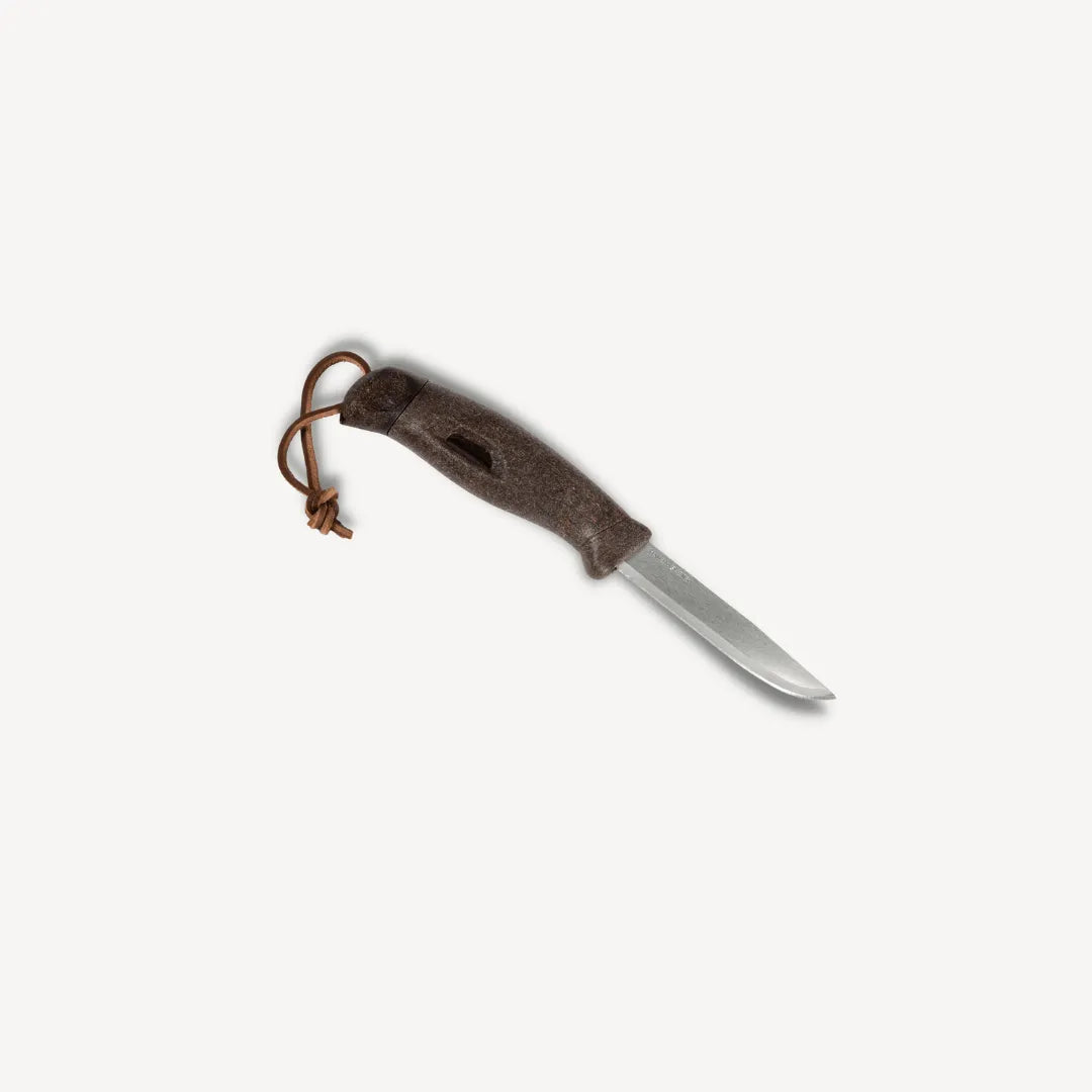 Brown knife with leather strap attached.