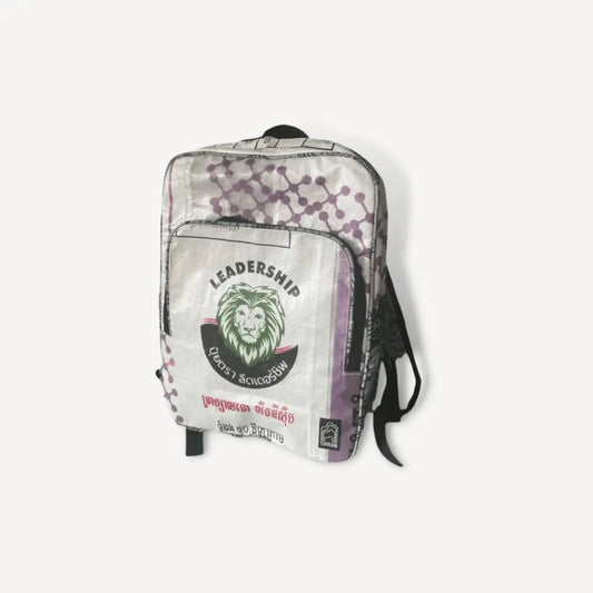 White and purple backpack with green lion head on it.