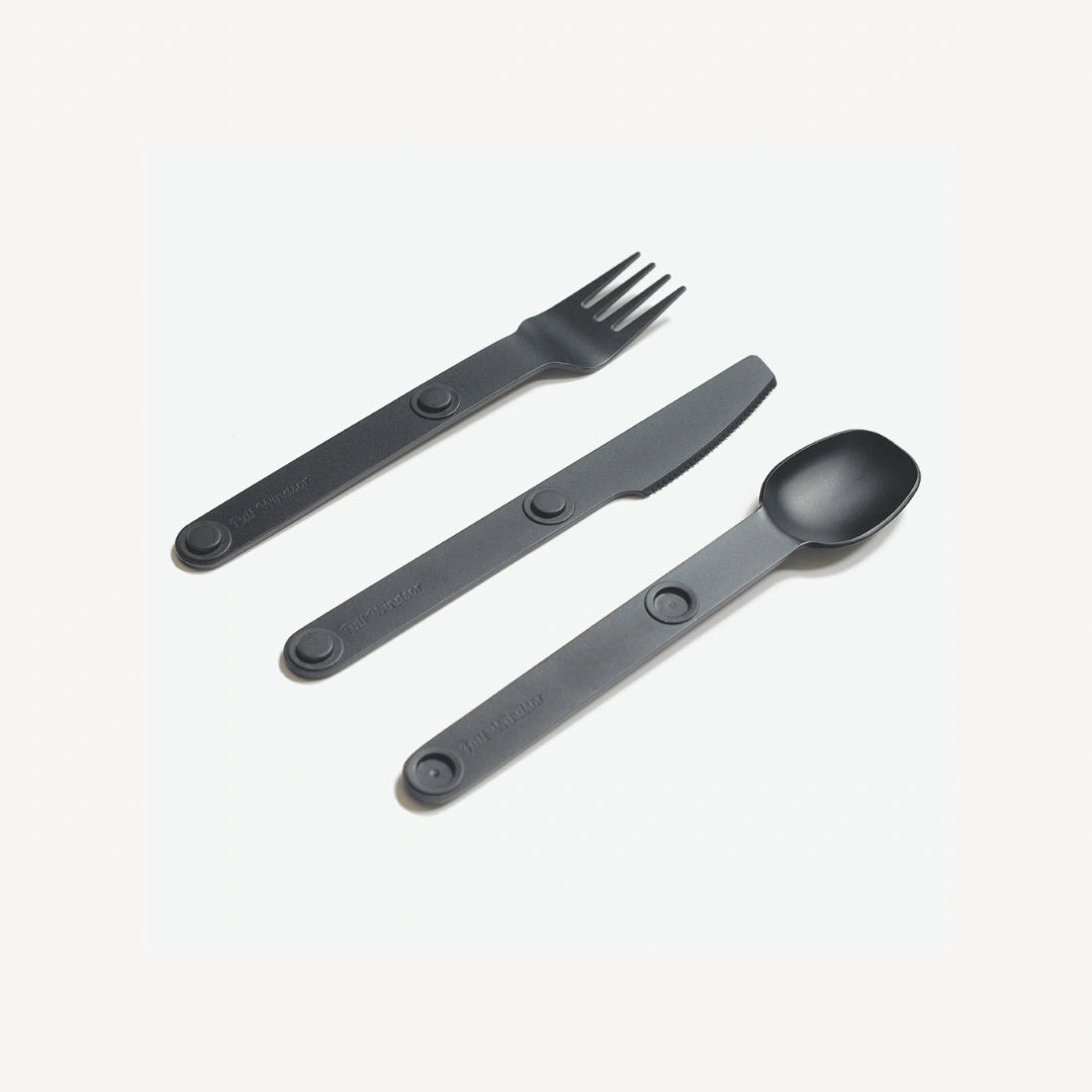 Black fork, spoon and knife angled.