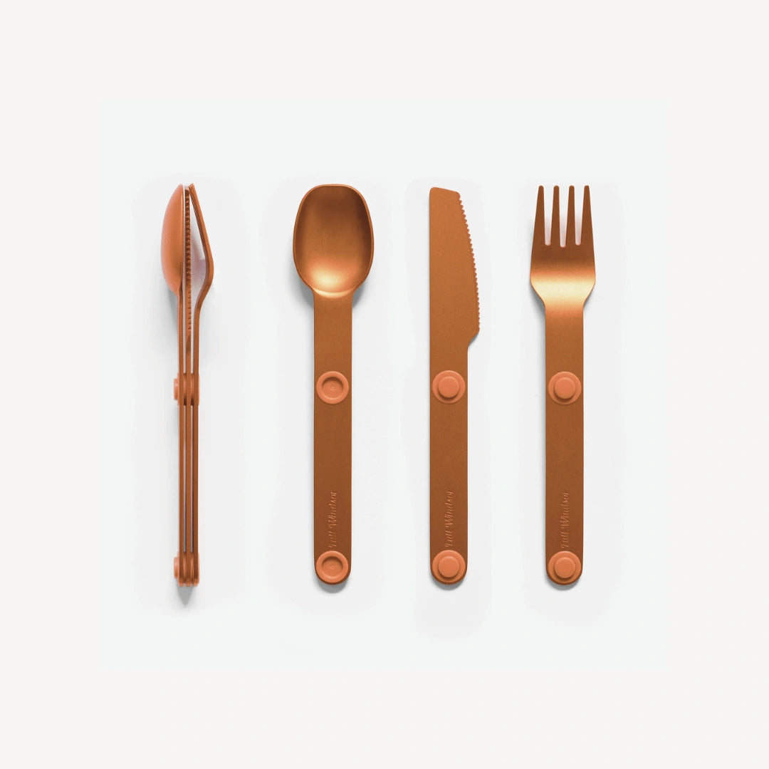 Orange fork, spoon and knife.