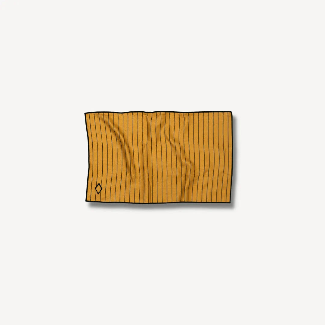 Small orange hand towel with black pinstripes.