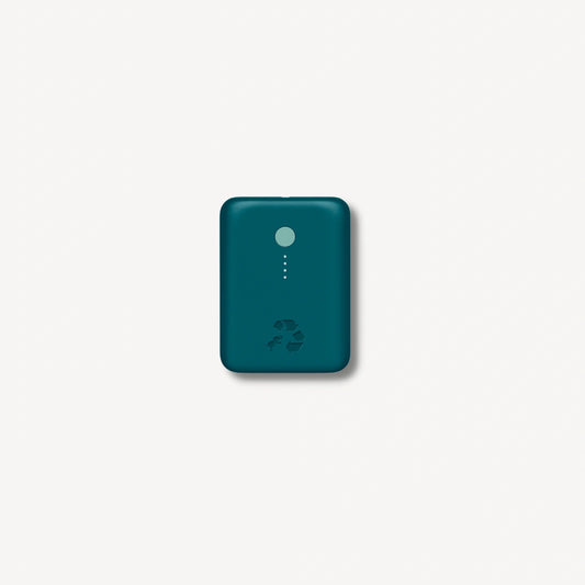Turquoise portable charger with green button.