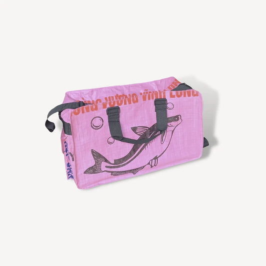 Pink duffel bag with a fish on it.