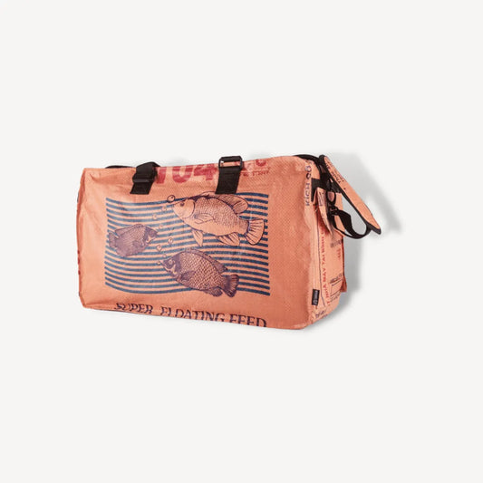 Orange duffel bag with stripes and a fish on it.