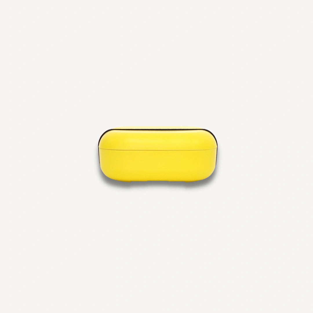 Side profile of yellow bento box.