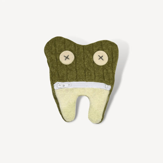 Green tooth fairy pouch in the shape of a tooth.
