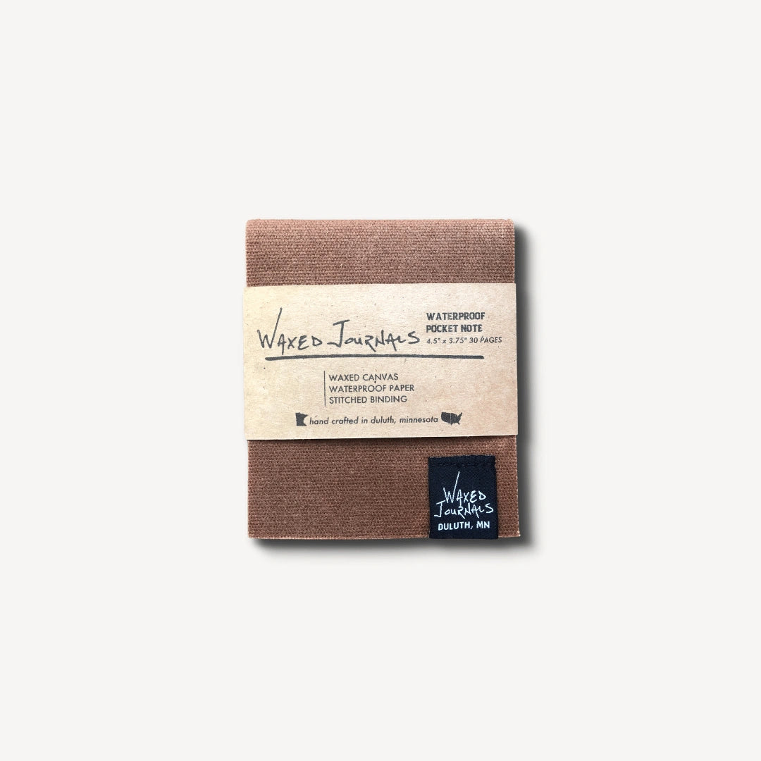 Brown waxed journal notepad in packaging.