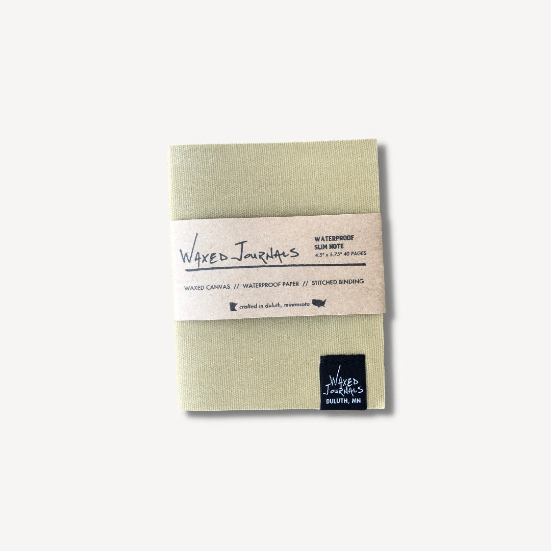 White waxed journal notebook in packaging.