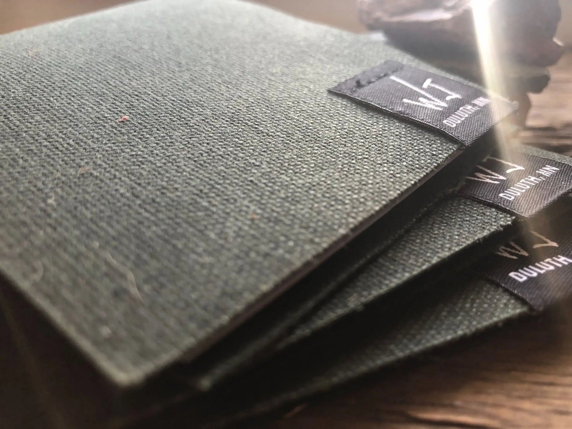 Stack of gray notebooks.