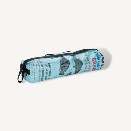 Blue yoga mat bag with fishes on it.